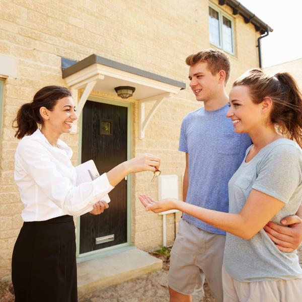 Image of a couple getting keys for a property